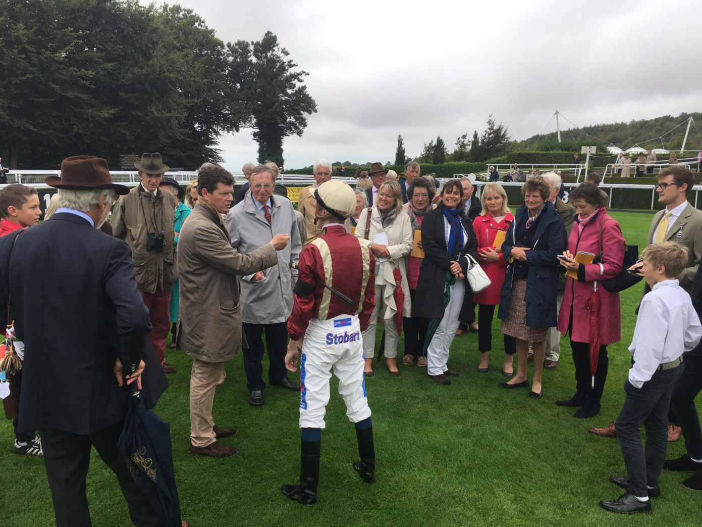 Owners talk with Golden Salute’s trainer Andrew Balding